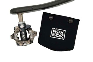Nox Sox Small Pedal Cover next to a Shimano XTR Clipless Pedal